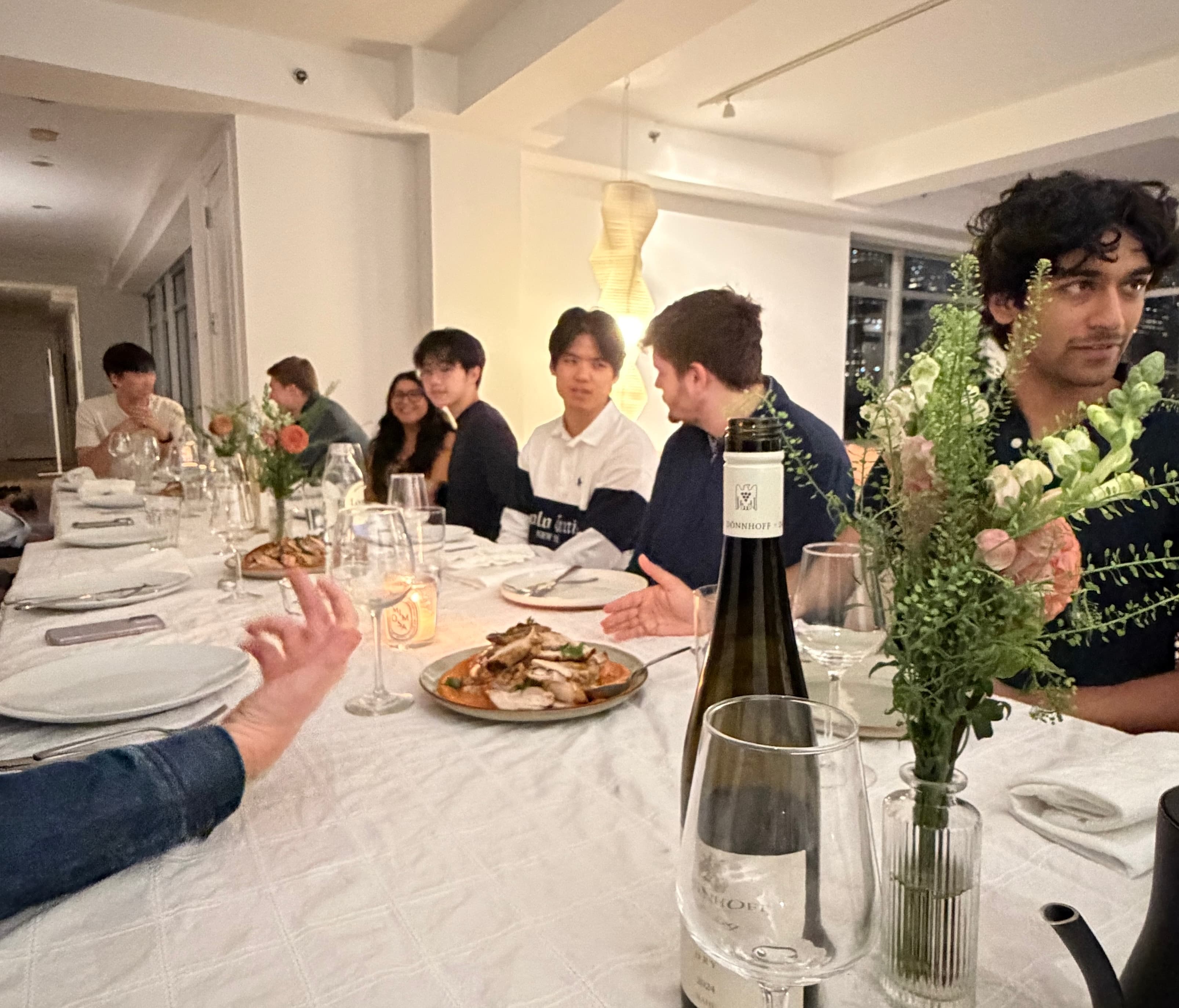 Guests gathered around a table for Oasis Supper Club #2 in Manhattan