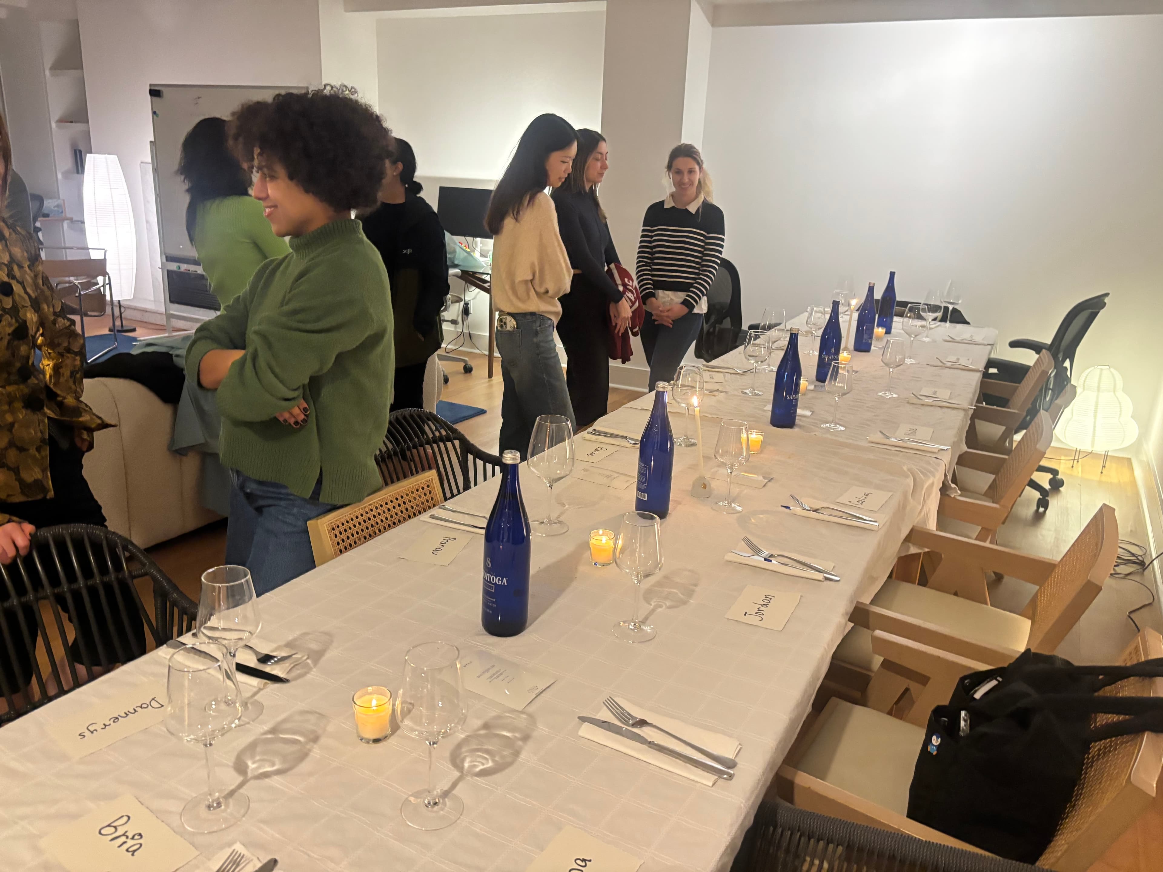 Guests gathered around the table at Oasis Supper Club #3 in Manhattan